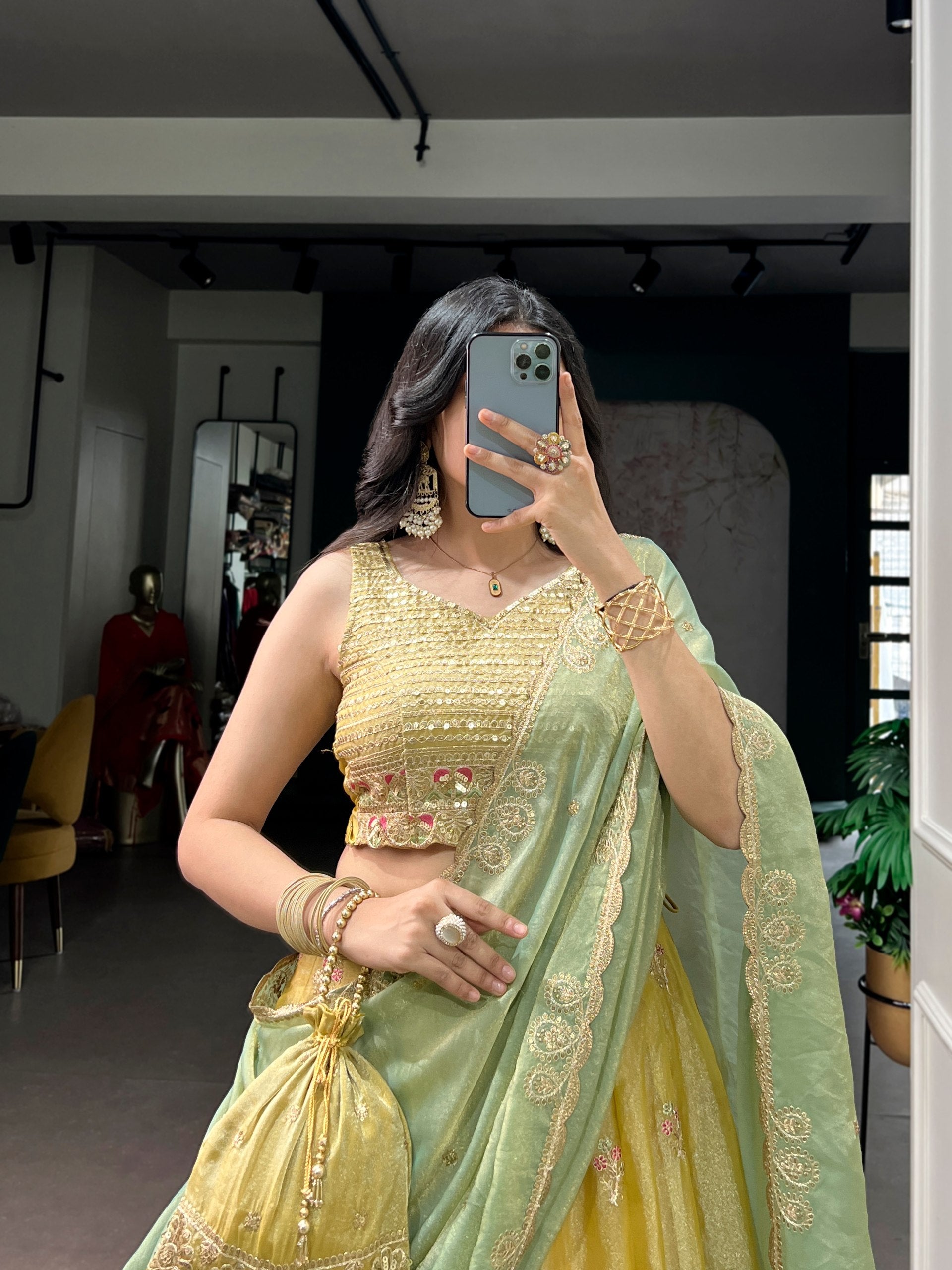 Yellow NC Moss Silk Designer Lehenga Choli with Embroidered Dupatta & Matching Batwa Bag