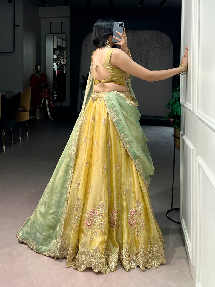 Yellow NC Moss Silk Designer Lehenga Choli with Embroidered Dupatta & Matching Batwa Bag