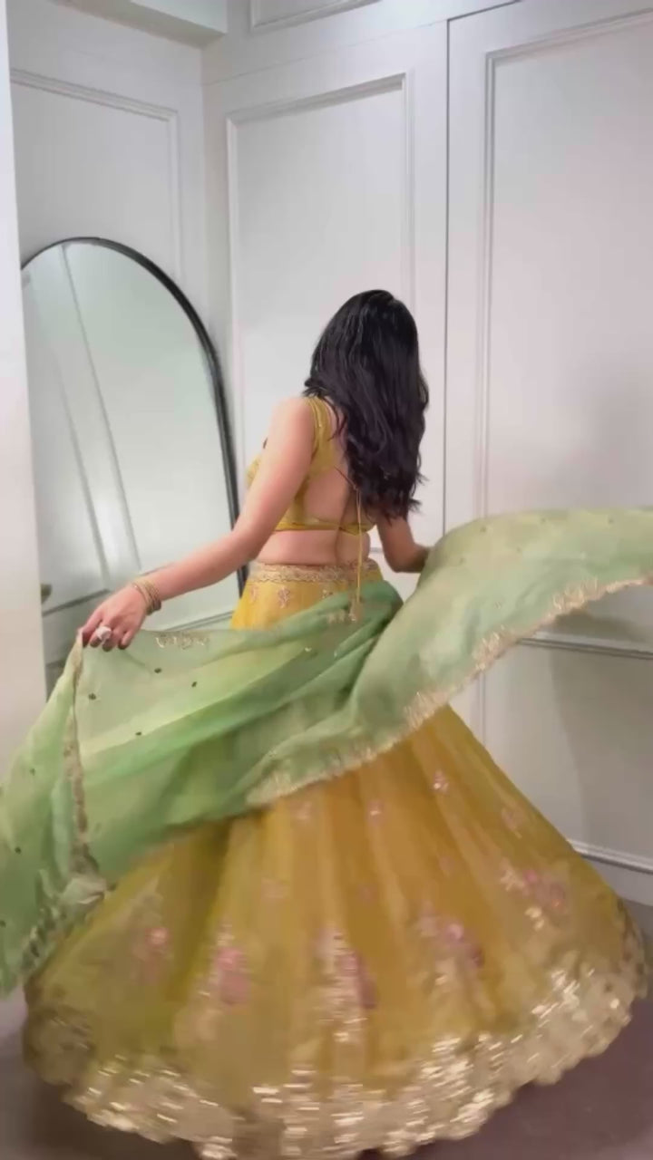 Yellow NC Moss Silk Designer Lehenga Choli with Embroidered Dupatta & Matching Batwa Bag